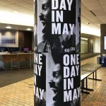 One Day in May posters wrapped around pole